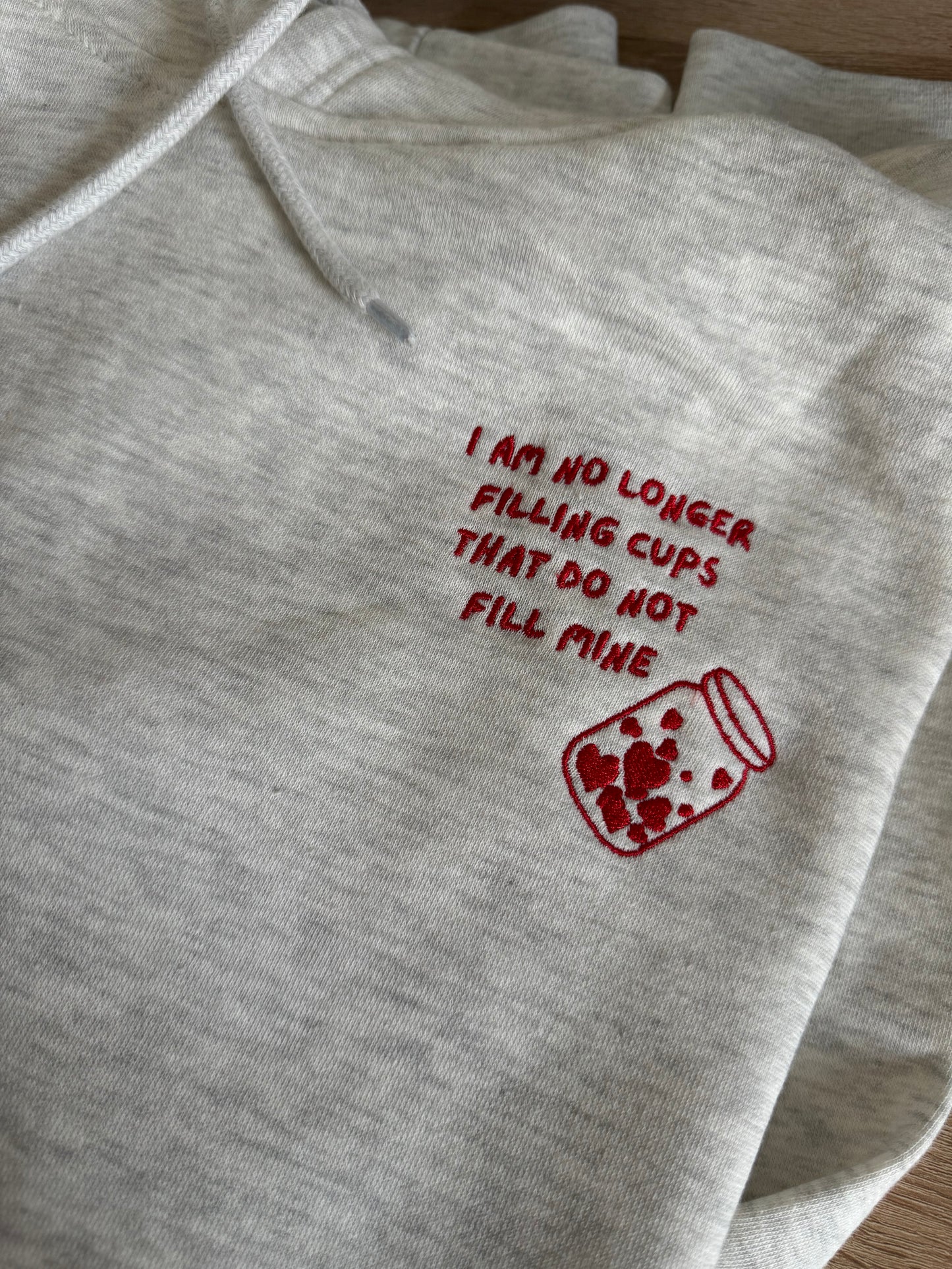 I am no longer filling cups Embroidered Premium Mid-Weight Hoodie